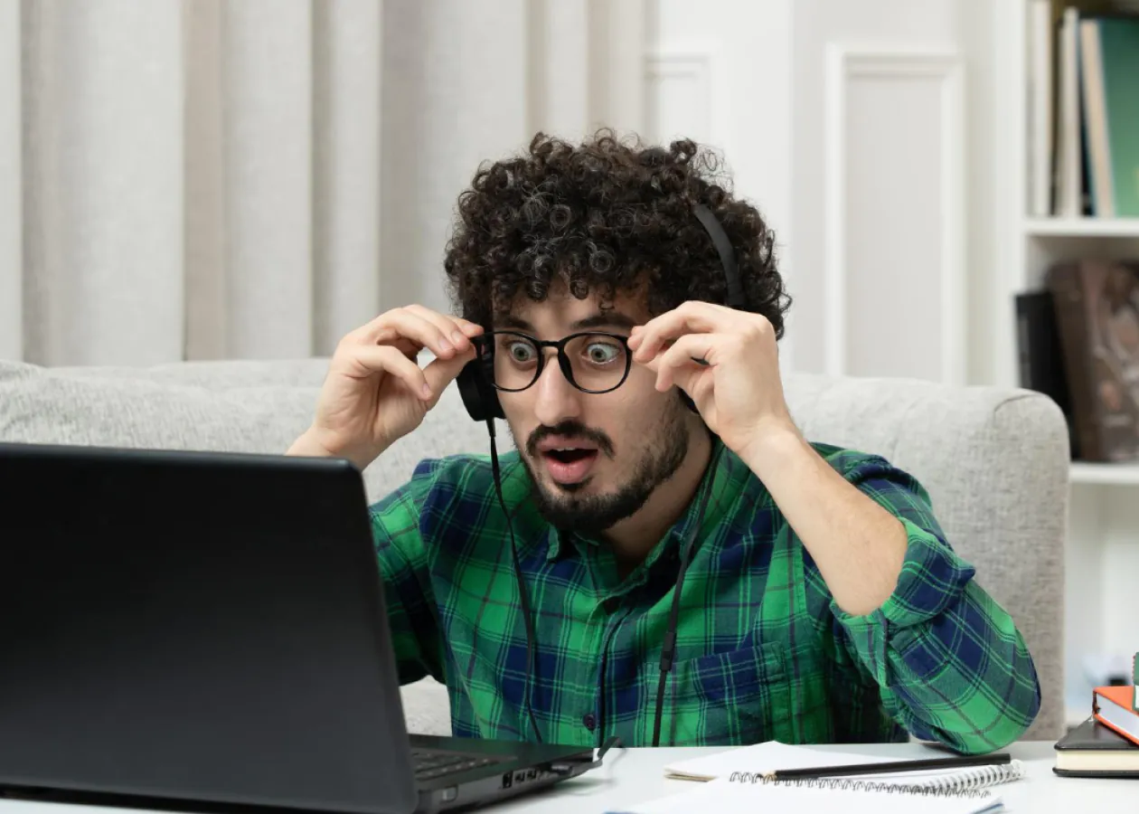 Person analyzing user behavior on digital devices, symbolizing data-driven UX research with a fresh perspective.